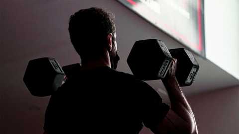 Man using dumbbells
