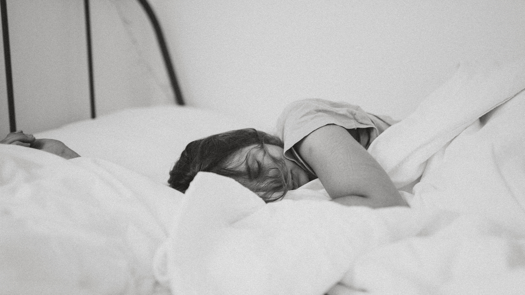 Woman sleeping in her bed